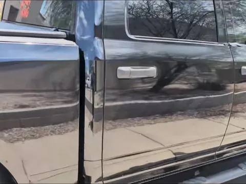 The same Ram doors washed to a deep black shine